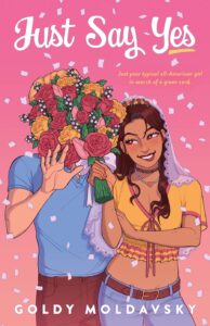 Illustrated cover for Just Say Yes. A Latina teenager smiles while she puts a wedding bouquet in a teenage boy's face. She has wavy reddish brown hair that goes to her mid back, and she's wearing a pink and yellow crop top, light blue jeans, brown belt, and a wedding veil draped back so you can see her face. The boy's face is entirely obscured, but he has lighter skin and blond hair and is wearing a blue polo and brown pants. He has one hand up like he was surprised by the bouquet in his face, and confetti falls around them both.