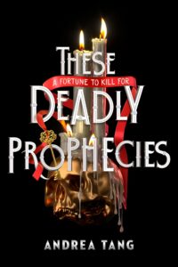 Black background with a gold skull. There is a golden key balancing on the space where the nose would be. There is a red ribbon through the top of the key that also wraps around the candles that are behind the skull. The words a fortune to kill for is written on the ribbon as it winds through the title.