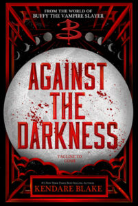 The book cover features a large moon in the center with accents in black and red. The title Against the Darkness is written on the moon and their are splatters of red on the surface too like blood. Above there are small moons showing the phases and a large letter B is centered above the large moon in the style of Buffy the Vampire Slayer.