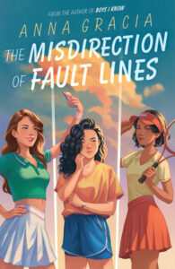 Cover of the book The Misdirection of Fault Lines. There are three young women standing in a row. The first has light brown hair wearing a crop top and tennis skirt and holding up a phone to take a selfie. The middle person has dark wavy hair and is wearing short. She appears pensive. The one on the right has a tennis skirt on and has short dark hair. She's holding a tennis racket and is wearing a visor.