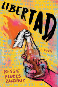 Illustrated cover of Libertad. The cover is dominated by a molotov cocktail. It is already lit and clutched tight in someone's hand. LIBERTAD is written above the flame in brush strokes.