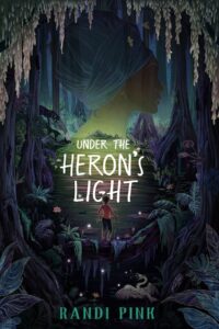 The cover of Under the Heron's Light features a dark outdoor area. There is a young person standing on a downed tree above water. There is a white bird down below.