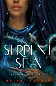 Illustrated book cover for Serpent Sea. The cover is a close up of a young woman, from about nose down to maybe her waist. She is wearing a beautifully detailed blue robe or cloak of some sort, with a purple scarf or something similar draped over hear head. There is a great silvery serpent wrapped around her, which appears to be at least partially made of glowing water. there are drops of water scattered all over.