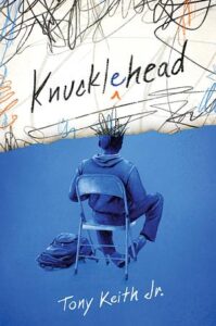 Cover for KNUCKLEHEAD. A Black boy with short hair sits in a metal folding chair with his back to the viewer. He has a backpack on the ground beside him, and the bottom of the cover is washed in blue. The cover looks like it is ripped so that it cuts off the top of his head. The rip reveals a white page with multicolored scribbles all over it, including black scribbles where the top of the boy's head should be. The handwritten title is centered above him, with the first e inserted, as if to correct the spelling.