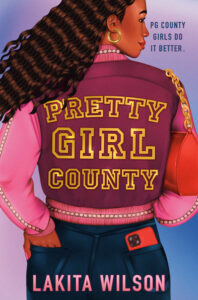 Illustrated cover for Pretty Girl County. A Black teenage girl stands with her back to the viewer, but she's glancing off to the right like something has caught her attention. She has shoulder-length wavy hair and is wearing a two-toned pink jacket and gold hoop earrings. She has a red purse over her right shoulder, a red cell phone peeking out of her right jeans pocket, and her free hand tucked into her left back pocket. The book title is written across the back of her jacket, like it is a Letterman style jacket.