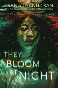 Illustrated cover features a young woman with long dark hair. She is under water with eyes wide open. Her hair is flowing around her. There are small bubbles floating around her. There are bits of red threadlike things floating near her hair and in front of her white shirt.