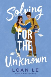 On a blue background, a young woman with long dark wavy hair is standing next to a young man who is slightly taller with short dark brown hair. Ther are holding an open binder together. She is looking at the page, he is looking sideways at her. He is holding a stack of books in one hand that has a disposable cup on it.