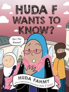 A young woman in a blue hijab is wearing glasses and a pink scarf. A word balloon next to her says Am I the drama?