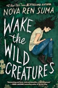 Book cover of Wake the Wild Creatures. A light skinned young woman with long dark hair is lying on the ground kind of curled up. There is a tear in the knee of her jeans.