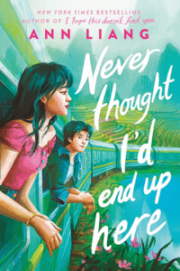 The cover of the book never thought I'd end up here. There is a train and from the closest window a young woman with dark hair is leaning out the window. In the second window a young man with short dark hair is also leaning out and is looking at her.