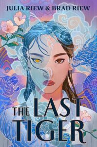 The book cover of The Last Tiger centers a young Korean woman with long dark brown hair. She has a golden eye on the left and a brown eye on the right. There is a blue somewhat translucent dragon to the right of her. To the left is a blue tiger. She is wearing a white hanbok. There are swirling clouds and flowers around her. She is staring straight ahead with focus.
