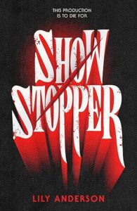 The book cover of Show Stopper. The background is black and the title is in white with red highlights. There is a red diagonal slash through the title. There are splatters of blood on the letters. Above the title it says, this production is to die for.