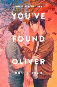 The book cover of you've found oliver has two young men standing close together and seem to be about to kiss as their heads are tilted. Their hands in the back are touching with fingers entangled. One has his hand on the others elbow and one has his hand on the others face.