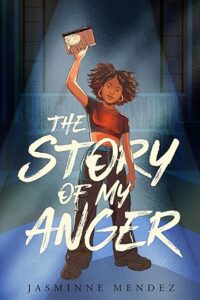 The book cover of the story of my anger features a young black woman on a stage holding a book up in her right hand. A spotlight is on her. 