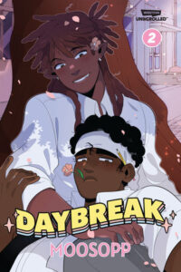 Illustrated cover for Daybreak, volume 2. Two Black teenage boys are underneath a tree. One of them is sitting with his back against the tree, while the other is lying back partially in his lap. They're both wearing white button-down shirts. The one sitting up is looking own at the other fondly, and the one lying down has a bit of a blush and looks a little embarrassed. Flower petals are falling around them, and they look peaceful.