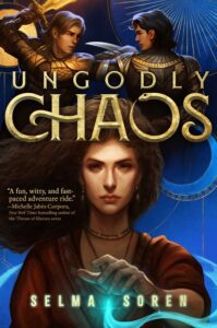 Illustrated cover of Ungodly Chaos. A teenage girl looks directly at the viewer with a serious expression. She has her left hand out in front of her, above the glowing pendant on her necklace. The blue light is streaming out of the pendant and curling around her. Above her, two boys in armor are fighting, one with light brown hair and a sword, and the other with black hair and a dagger.