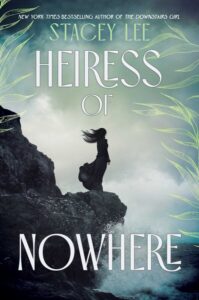 Illustrated cover for Heiress of Nowhere. A young woman stands with her back to the viewer on a rocky outcropping over the ocean. The wind is blowing her long black and and black dress back, and the waves crash against the bottom of the rocks she's standing on.