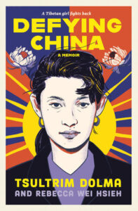 Book covers for Defying China: A Memoir. Above the title it says a Tibetan girl fights back. The style is like a poster. The background is a yellow sun with rays and behind it are read a dark blue stripes going out in thicker stripes at the same angles as the rays. There are two lotus flowers near the title. A young woman is centered with her hair pulled back wearing medium sized hoop earrings.